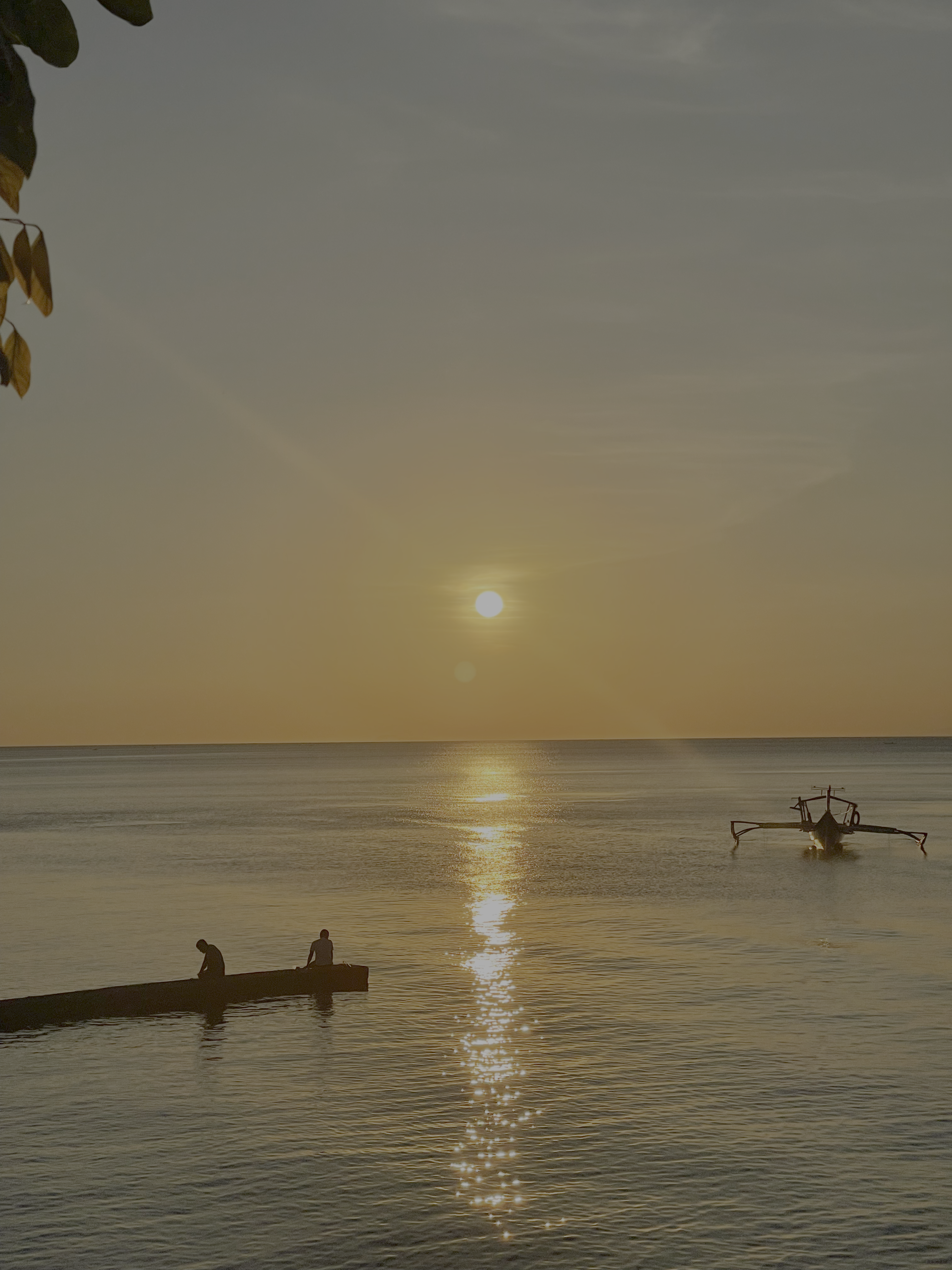 Sunset over the water and boats in Mabini, Batangas